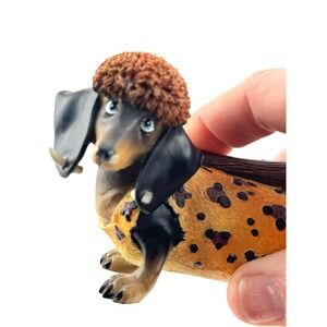 Cute Dachshund Dog Figurine Wearing Leopard Print Outfit and Furry Hat with Bone